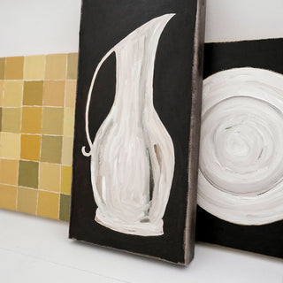 Original oil painting of a white ceramic pitcher on a black background by artist Alex Bodishbaugh. Contemporary black and white still life with expressive, textured brushstrokes.