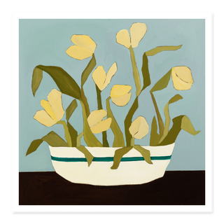 Yellow tulips floral art print in striped ceramic bowl with blue background