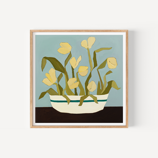 Yellow tulips floral art print in striped ceramic bowl with blue background